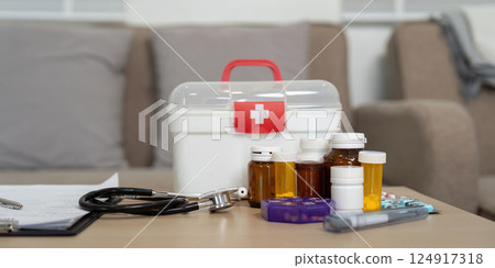 Essential Care Supplies. A well organized first aid kit and medications ready for home health care. Essential Care Supplies. A well organized first aid kit and medications ready for home health care. 124917318