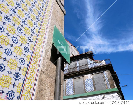 A street corner in Porto: Beautiful decorative tile exterior of a house (Portugal) 124917445