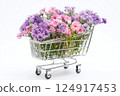 Shopping cart with summer pink flowers on white background, an empty space for text. Festive banner, template for advertisements of online shopping, flower delivery, weddings, floral gifts 124917453