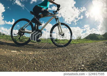 Woman riding mountain bike in the beautiful mountains 124917595