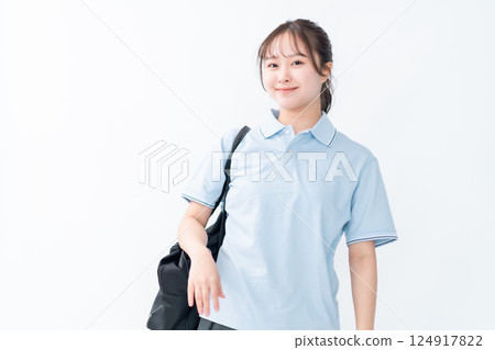 Young student wearing a polo shirt on white background 124917822