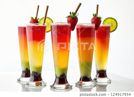 This image showcases four vibrant, multi-layered cocktails in tall glasses. Each drink features five distinct layers of different colors, creating a striking rainbow effect from bottom to top. 124917954