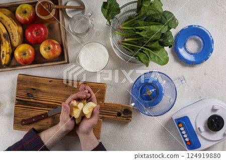 Guy making smoothie from fresh fruits 124919880