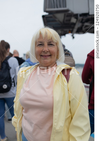 Travel, airport and excited woman traveler with luggage going to plane. Travel ticket and documents for immigration, journey Travel, airport and excited woman traveler with luggage going to plane. Travel ticket and documents for immigration, journey 124920750