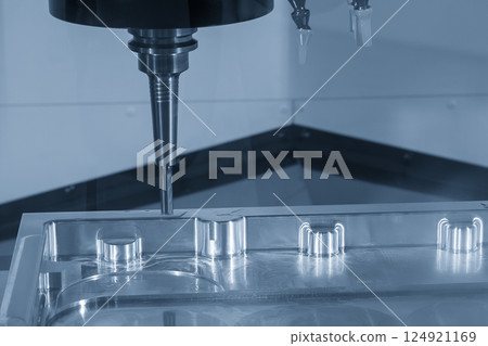 The CNC milling machine finish cut the aluminum parts by flat nose end mill tools in the light blue scene. The CNC milling machine finish cut the aluminum parts by flat nose end mill tools in the light blue scene. 124921169