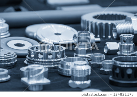 Close up scene the group of high precision parts in the light blue scene. 124921173