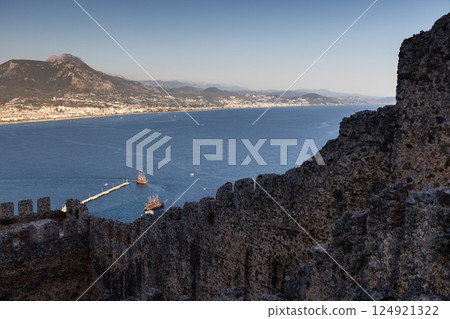 A captivating view of a coastal landscape with historic walls of Alanya Kale A captivating view of a coastal landscape with historic walls of Alanya Kale 124921322