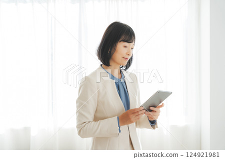 A middle-career woman pondering after looking at the results 124921981