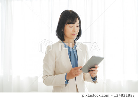 A middle-career woman pondering after looking at the results 124921982