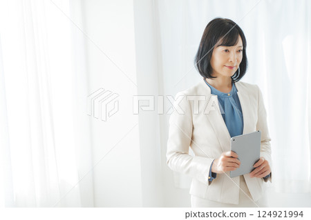 A middle-career woman pondering after looking at the results 124921994