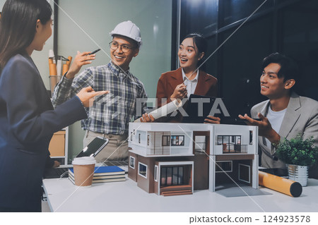 Construction, planning and architects meeting about design of building, strategy and working in industrial collaboration. Architecture workers talking about maintenance project with paper and a model 124923578