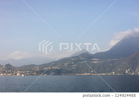 Como Lake landscape. Village, trees, water and mountains. Italy, Europe. Como Lake landscape. Village, trees, water and mountains. Italy, Europe. 124924488