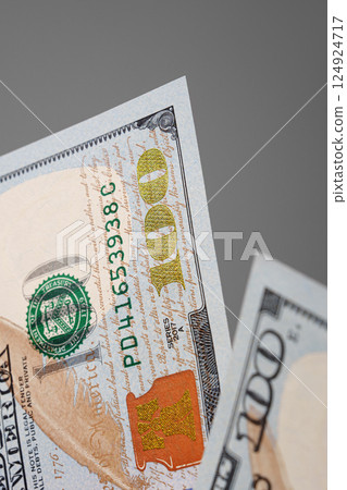 Close up of cash. New hundred dollar bills. Financial concept. 124924717
