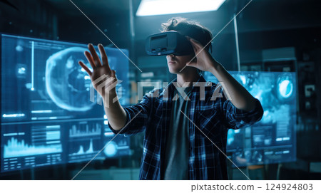 A student man learns online with futuristic technology. The concept of education, innovation, and digital learning. Generative AI. A student man learns online with futuristic technology. The concept of education, innovation, and digital learning. Generative AI. 124924803