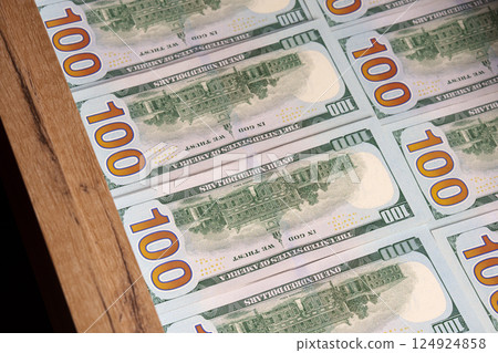 Perfectly laid out hundred dollar curets in a drawer. Savings. Financial concept. Perfectly laid out hundred dollar curets in a drawer. Savings. Financial concept. 124924858