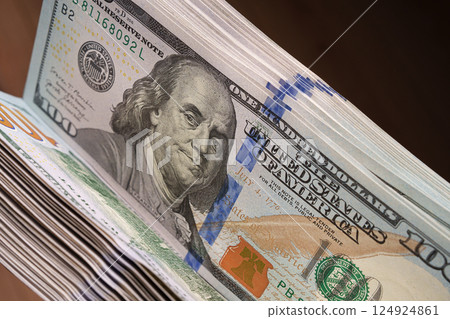 Close-up of 100 dollar banknotes. A large number of them. Financial concept. Close-up of 100 dollar banknotes. A large number of them. Financial concept. 124924861