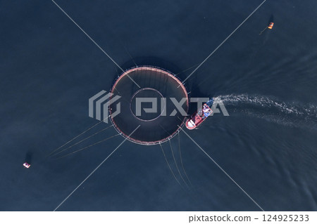 Image of fish ponds, the main form of aquaculture. Salmon, sea bass, sea bream and trout are the most commonly grown fish in fish ponds used for commercial fishing in the sea, lakes and ponds. Image of fish ponds, the main form of aquaculture. Salmon, sea bass, sea bream and trout are the most commonly grown fish in fish ponds used for commercial fishing in the sea, lakes and ponds. 124925233