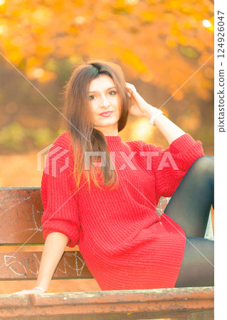 lady relaxing on bench. lady relaxing on bench. 124926047