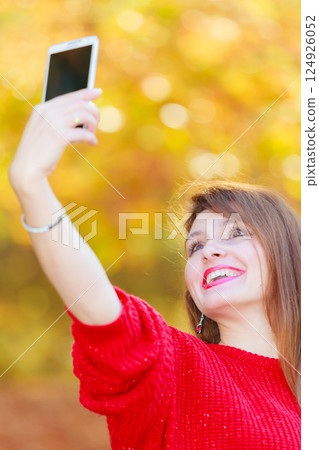 Lovely girl with smartphone taking selfie photo. Lovely girl with smartphone taking selfie photo. 124926052