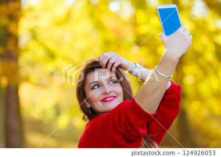 Gorgeous girl taking selfie. 124926053