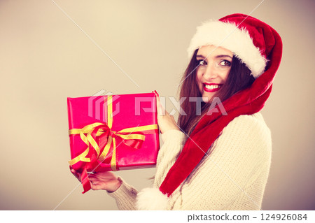Woman holding gift box. Christmas time Woman holding gift box. Christmas time 124926084