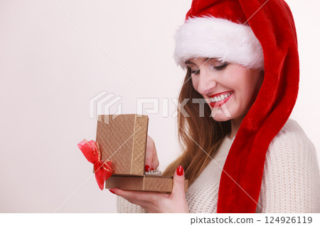 Woman opening gift box. Christmas time 124926119