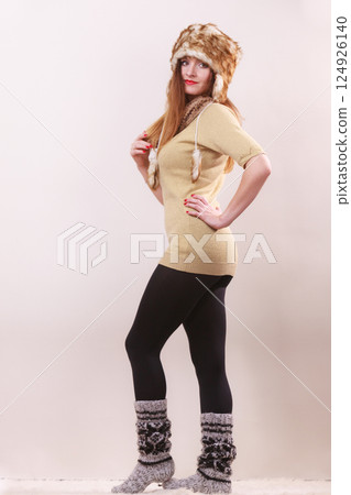 Beautiful winter woman in warm clothing Beautiful winter woman in warm clothing 124926140