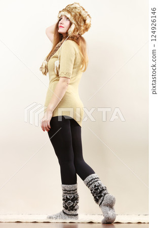 woman wearing warm clothes fur cap socks woman wearing warm clothes fur cap socks 124926146