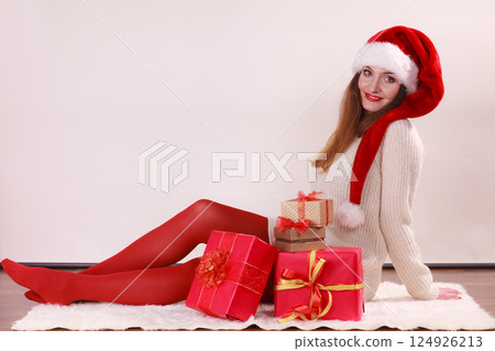 Happy woman make christmas presents 124926213