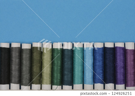 Colorful spools of thread 124926251