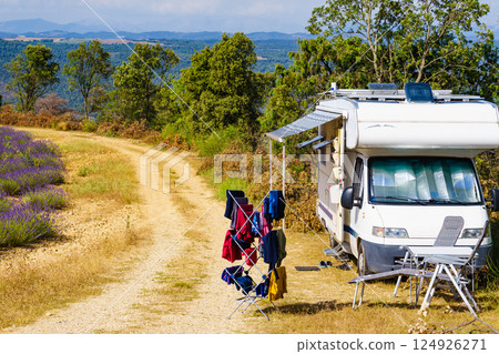 Clothes hanging to dry outdoors by camping car. Caravan vacation. Clothes hanging to dry outdoors by camping car. Caravan vacation. 124926271