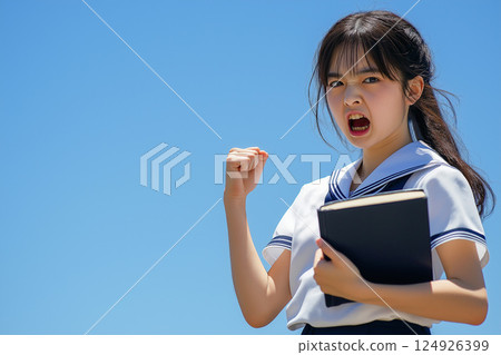 A positive female student's fist pump towards her goal 124926399