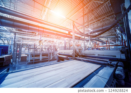 Production line of the wooden floor factory. CNC automatic woodworking machine. 124928824