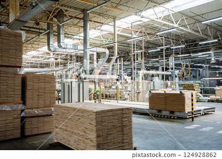 Production line of the wooden floor factory. CNC automatic woodworking machine. 124928862