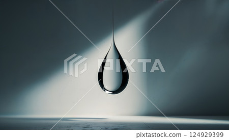 Big mercury drop hanging in a dark room with light beams 124929399