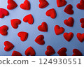 texture pattern of red hearts on blue cyan background Valentines day card concept. Heart for Valentines Day Background 124930551