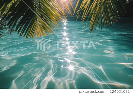 Vibrant underwater view with sunlight filtering through tropical leaves in clear blue water 124931021