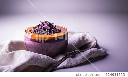Refined dessert of layered mousse topped with chocolate shavings, served in a simple cup with natural styling and creamy atmosphere 124931513