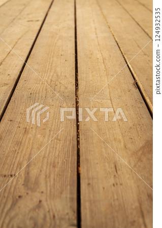 Rustic weathered wooden planks create a textured background ideal for design projects 124932535