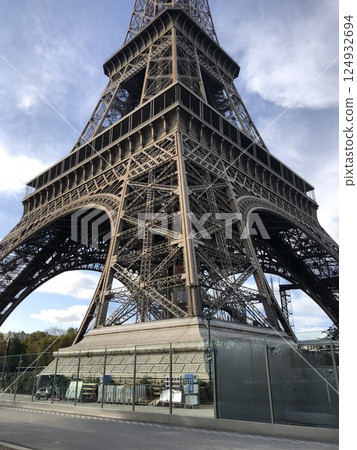 Eiffel Tower, angled view from below. Close-up. Lower part. 124932694