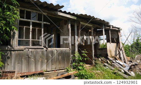 View to destroyed residential buildings at Kharkivska oblast. Ruined houses after bomb attacks on ukrainian territory from russia army. Consequences of russian invasion of Ukraine. Slow motion 124932901