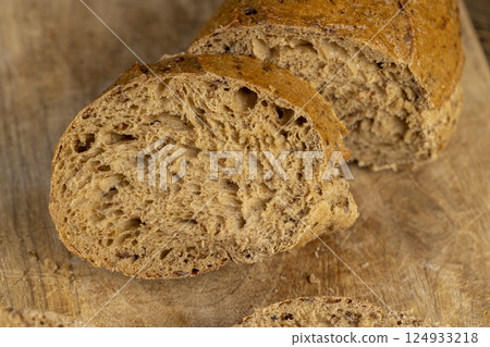 a healthy loaf of soft bread with added seeds and bran 124933218
