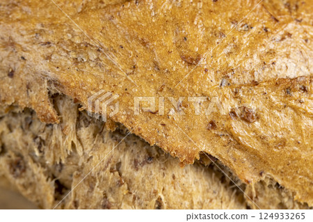 a fresh loaf of bread made from a mixture of wheat and rye flour 124933265