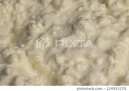 sprinkled with sour cream fermented milk product cottage cheese, closeup sprinkled with sour cream fermented milk product cottage cheese, closeup 124933278