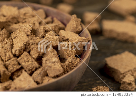 small pieces of cork bark for domestic use, closeup pieces in a bowl small pieces of cork bark for domestic use, closeup pieces in a bowl 124933354