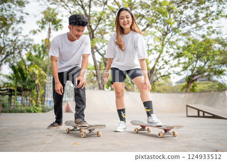 Enjoying a thrilling skateboarding day at the park with friends and family Enjoying a thrilling skateboarding day at the park with friends and family 124933512