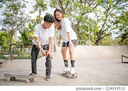 Skateboarding Fun Young Friends Thrillingly Enjoying Their Outdoor Activity Together Skateboarding Fun Young Friends Thrillingly Enjoying Their Outdoor Activity Together 124933513