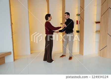 Couple enjoying a dance together in a sleek modern studio space 124934124