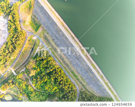 Aerial Drone shot bird eye view rainforest and road around the dam lake,Landscape nature view Aerial Drone shot bird eye view rainforest and road around the dam lake,Landscape nature view 124934659