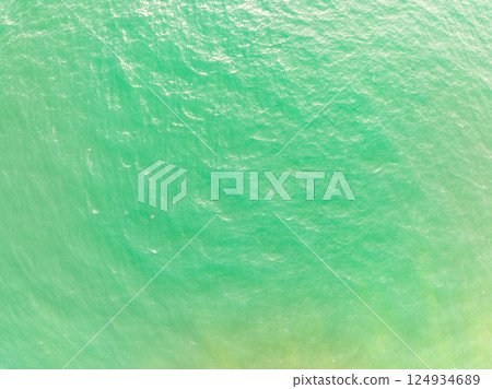 Sea surface aerial view,Bird eye view photo of waves water surface texture,Summer sea background,Beautiful nature Amazing view sea background 124934689